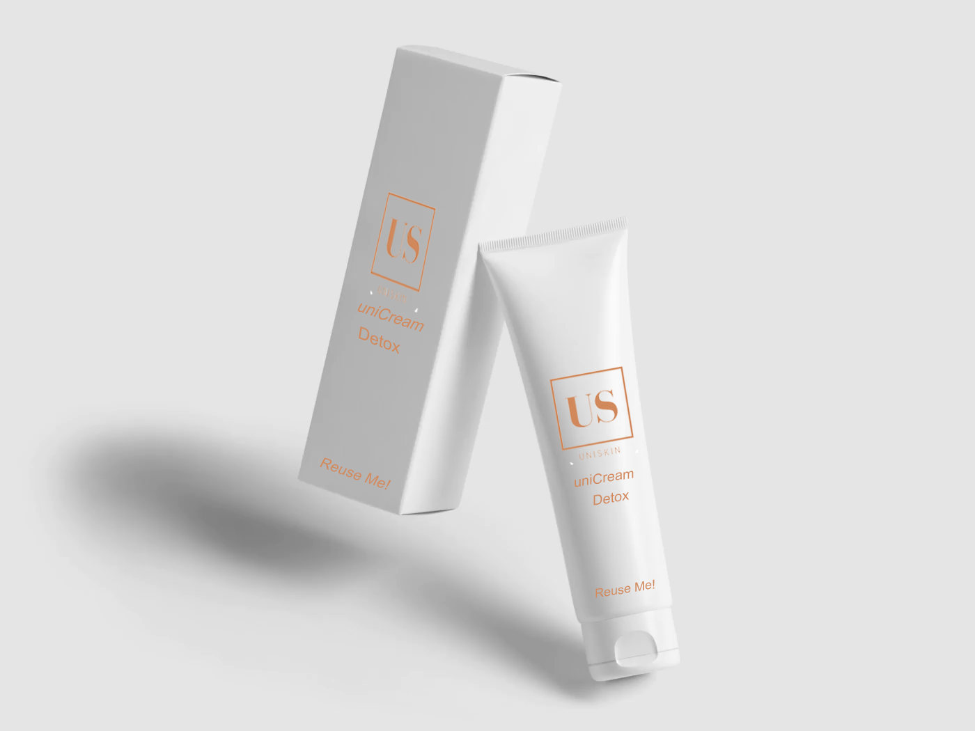 A white card box and a tube of cream both with the logo of uniSkin.