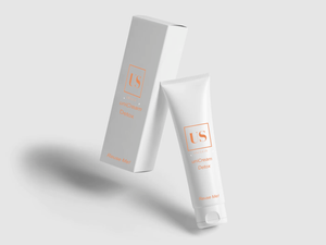 A white card box and a tube of cream both with the logo of uniSkin.