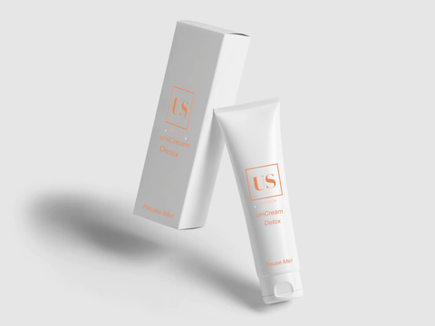 A white card box and a tube of cream both with the logo of uniSkin.