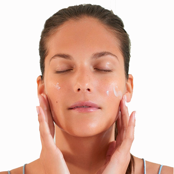 woman applying uniCream - detox cream to moisturize and hydrate her face.