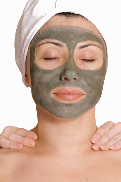 woman relaxing with uniMask - detox mask on her face